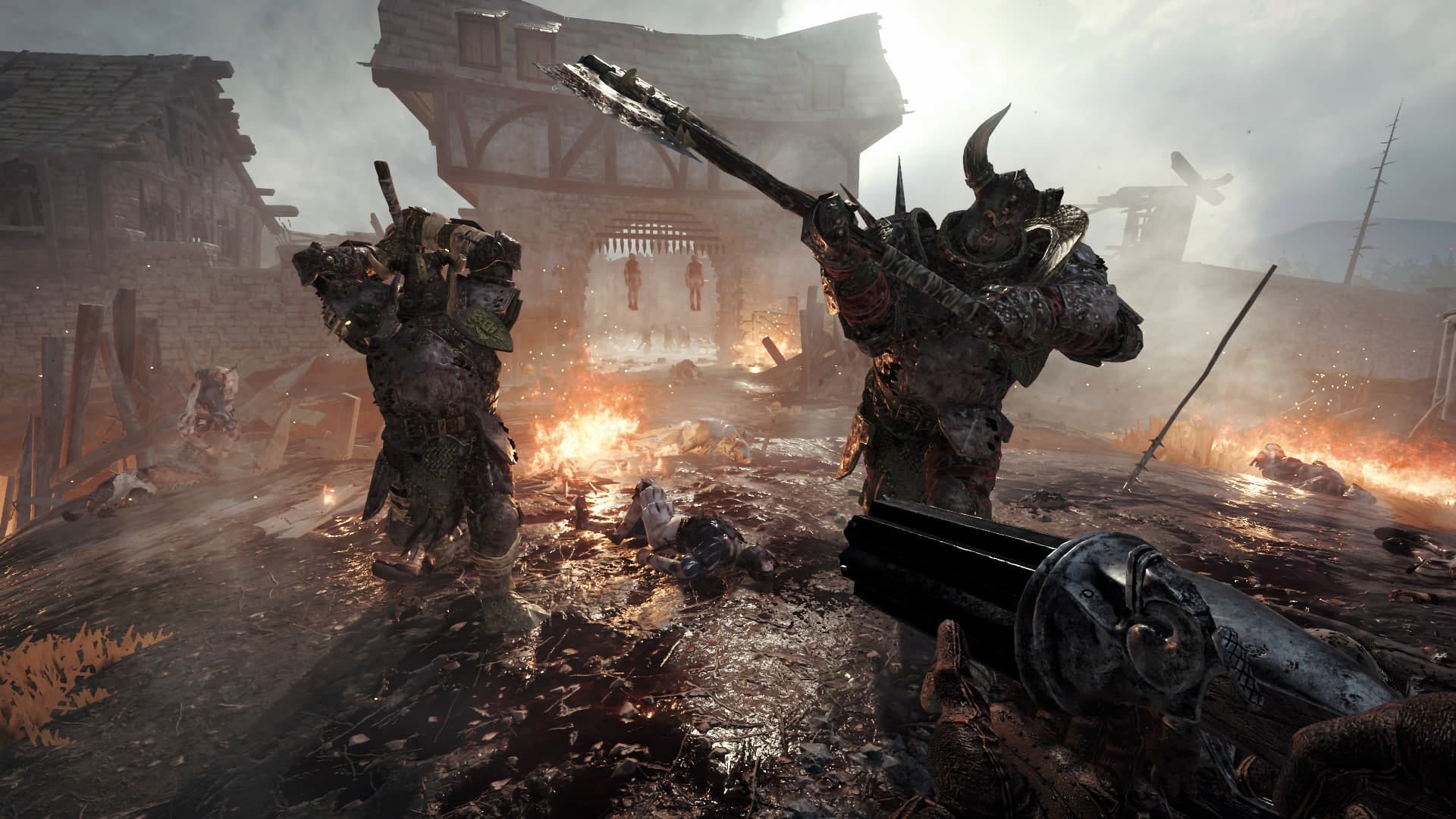 Vemintide 2 free screenshot where we see a player with a loaded gun and 2 large enemies charging toward them 
